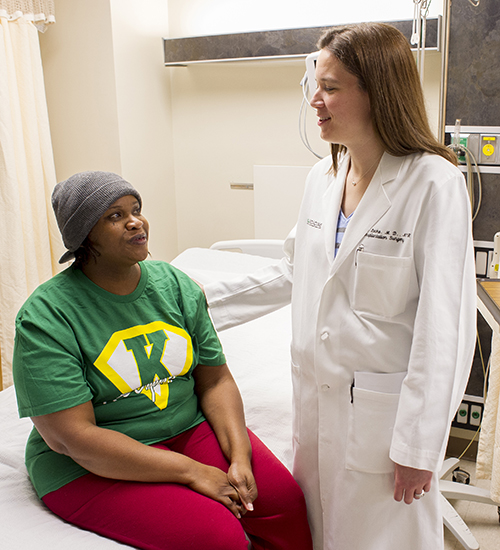 Dr. Jayme Locke talks to kidney chain transplant patient Veronica Temple at UAB Hospital.