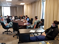 Faculty meeting six feet apart