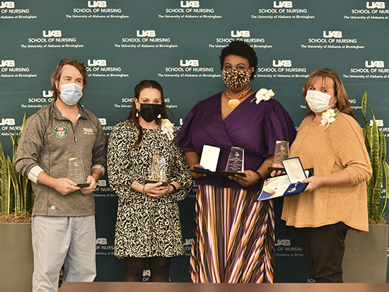UAB nurses holding awards at award ceremony