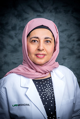 Headshot of Dr. Sumayah Abed, MD (Assistant Professor, Family and Community Medicine) in white medical coat, 2020.