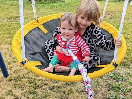 Everleigh and sister in swing Inside 3