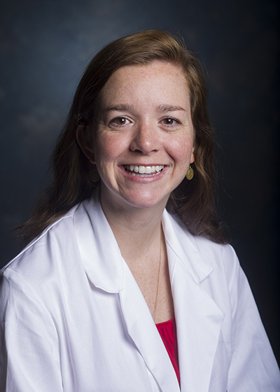 Head shot of Dr. Erin DeLaney, MD (Assistant Professor, Family and Community Medicine) in white medical jacket (2013).