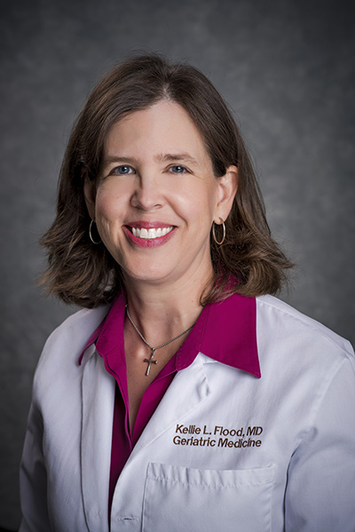 Head shot of Dr. Kellie Flood, MD (Associate Professor, Gerontology/Geriatrics/Palliative Care) in white medical coat, 2018.