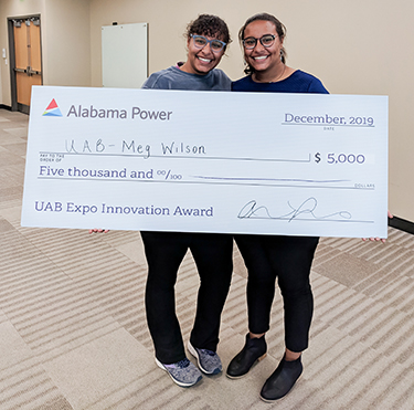 Meg Wilson receives her $5,000 innovation grant.