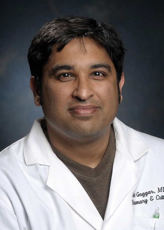 Head shot of Dr. Amit Gaggar, MD, PhD (Associate Professor, Pulmonary/Allergy/Critical Care; Director, UAB Cystic Fibrosis Inflammation Group; Co-Director, Pulmonary Biospecimen Sample Repository) in white medical coat, 2009.