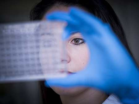 MD/PhD Medical Scientist unidentified female student conducting research in laboratory in Civitan International Research Center (CIRC), 2014.