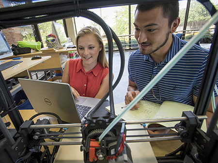 Paige Severino (Student, Biomedical Engineering) and Ali El-Husari (Student, Biomedical Engineering) are creating the first prototype of their concept on a 3-D printer at the UAB MakerSpace, 2018.