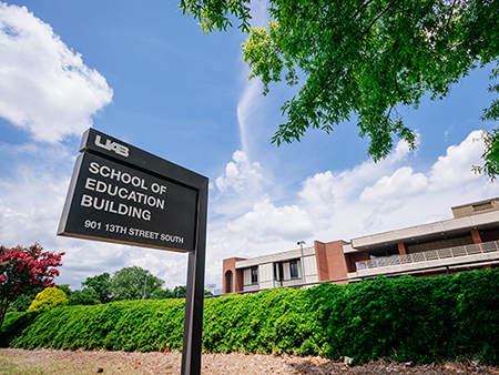 Close-up of sign that reads "UAB School of Education Building" in front of the School of Education Building, 2019.