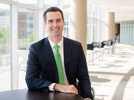 Environmental head shot of Tyler Peterson (Executive Director of Admissions and Financial Aid, Undergraduate Admissions), 2018.