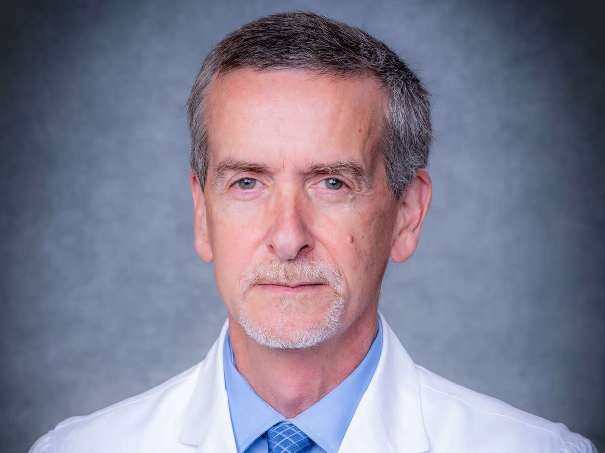 Headshot of Dr. Burt Nabors, MD (Professor, Neurology) in white medical coat, November 2020.