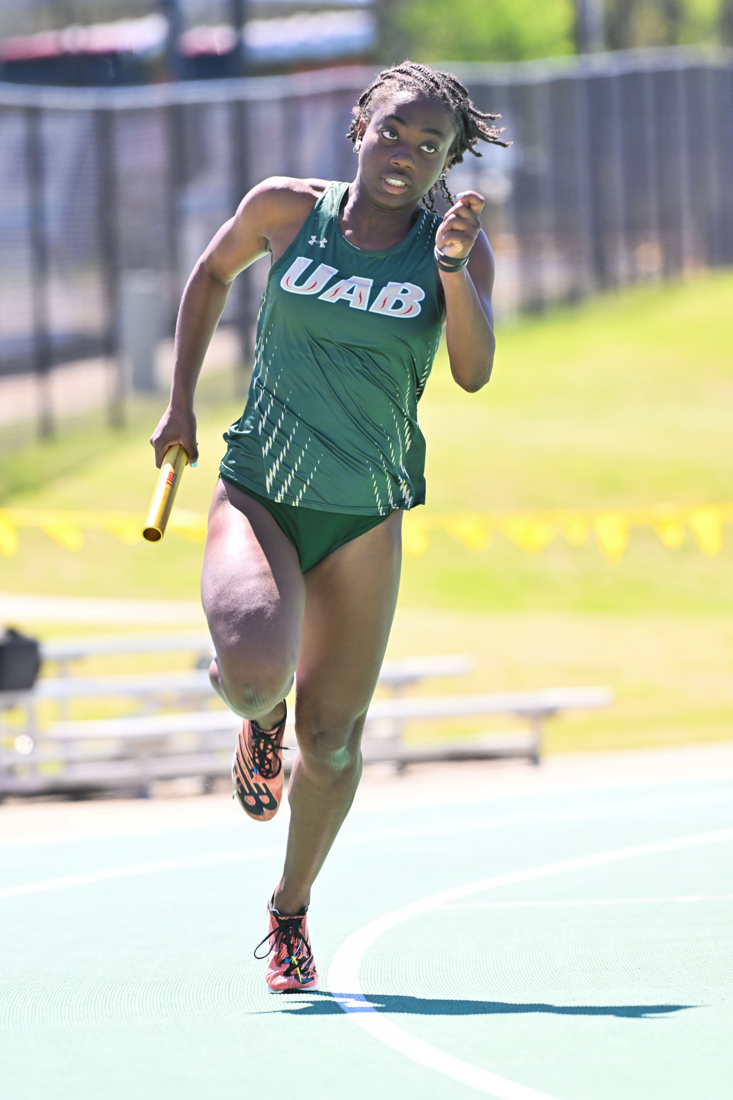 Taylor Washington running on the track field