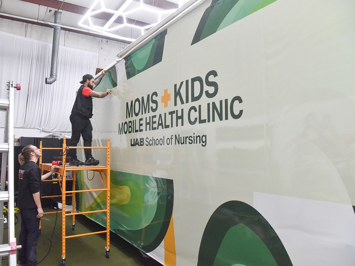 Moms and Kids Mobile Health Clinic being wrapped.