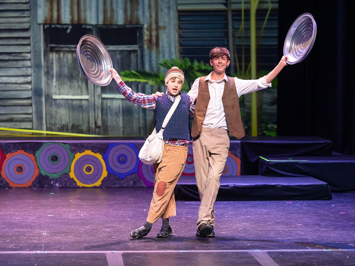 Two boys participating in a production of 