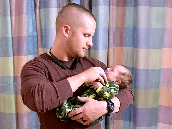 Father unites with baby in NICU for first time after deployment