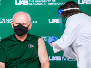 UAB President Ray Watts, M.D., receiving his COVID vaccine. In addition to his role as University President, Watts is a practicing physician and sees patients regularly in his clinic.