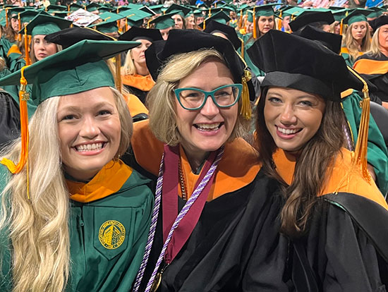 Photo of Aimee Holland with UABSON Students