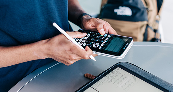 Some unknown person using a calculator