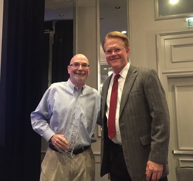 Mark Swanson, O.D., (left) professor at the UAB School of Optometry, was named Educator of the Year by the Alabama Optometric Association.