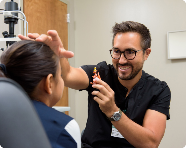 A specialist and a patient at a clinical eye exam