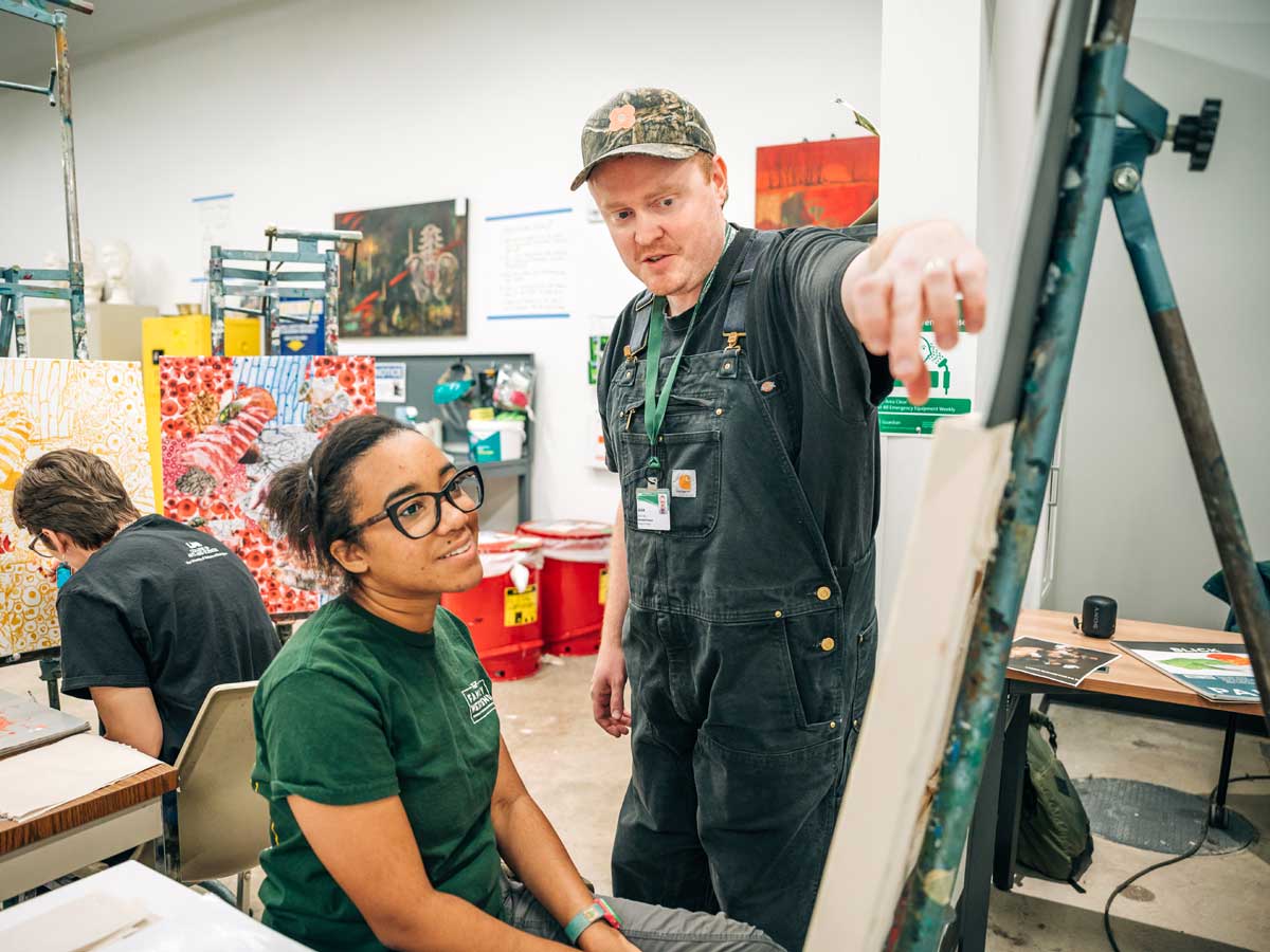 image of a professor and a student in a art class