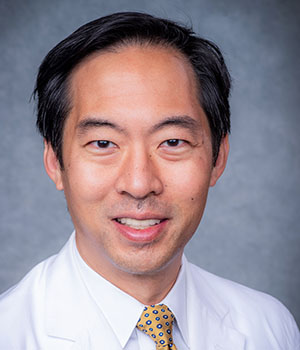 Headshot of Dr. Daniel Chu, MD (Associate Professor, Surgery - Gastrointestinal) in white medical coat, November 2020.