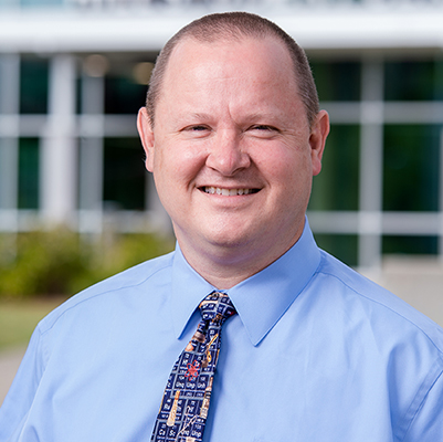 Environmental headshot of Dr. Justin Roth, PhD (Associate Director of Research Health and Safetyt - Biosafety, Environmental Health and Safety), May 2021. 
