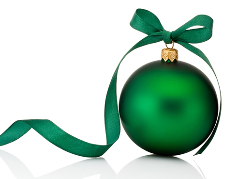 Green Christmas ball with ribbon bow Isolated on white background