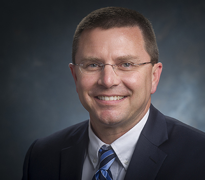 Head shot of Thomas "Tom" Brannan (Sr. Associate VP, Development and Alumni), 2016.