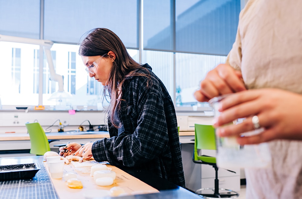 Closeup of student Cam Boydstun working on a project to develop realistic kidneys for surgical training.