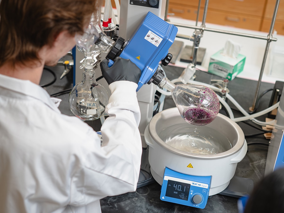 Mason Bayles operates a roto-evaporator in the Pyrch Lab