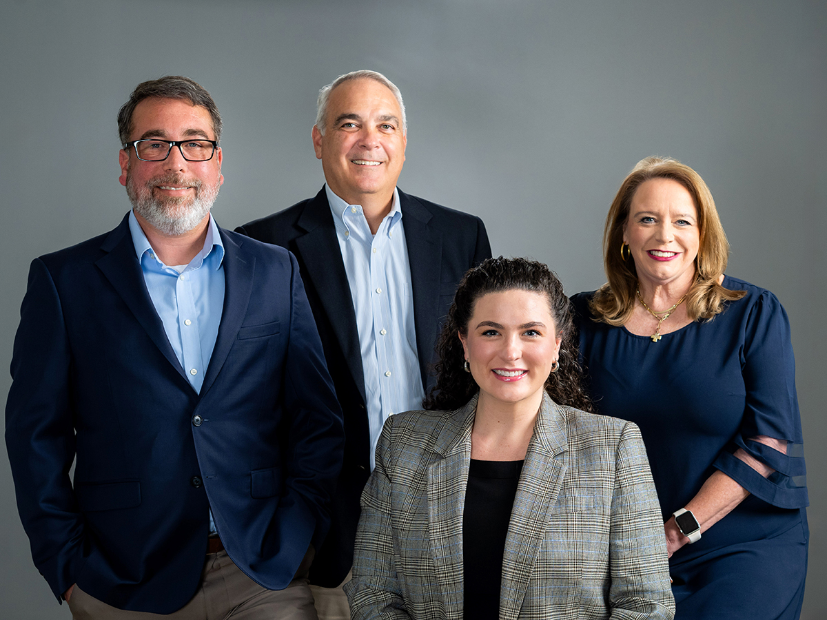 University Compliance leadership team members Jereme Logan, James Erwin, Courtney Champion and Audrey Fortier