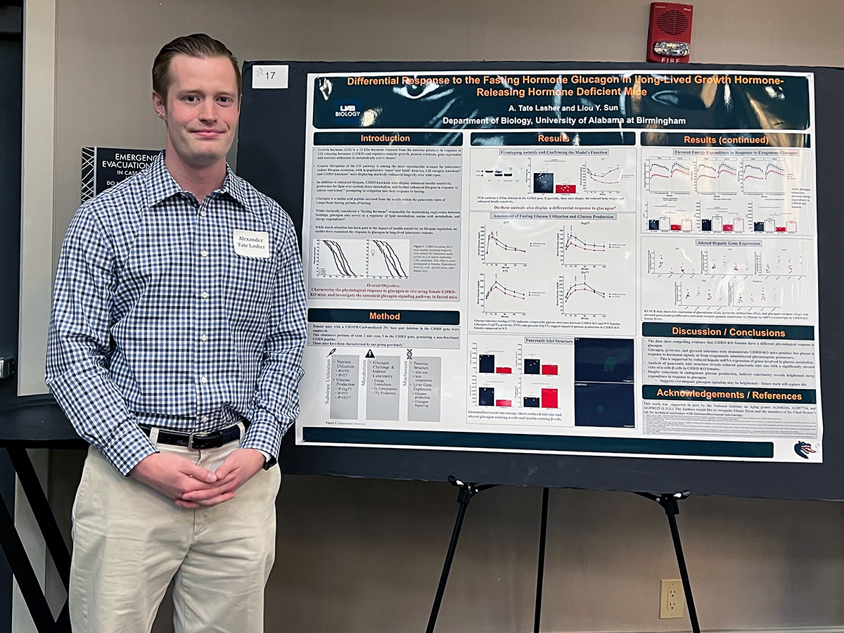 Alexander Tate Lasher with his poster presentation.