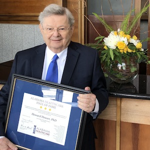 Howard W. Houser with Hall of Fame plaque