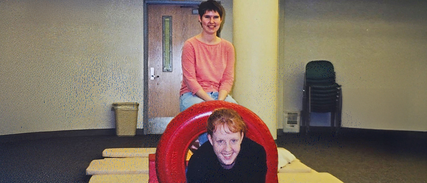 Two women in some sort of play area in 2001.