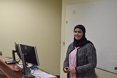 Almutairi giving dissertation speech.