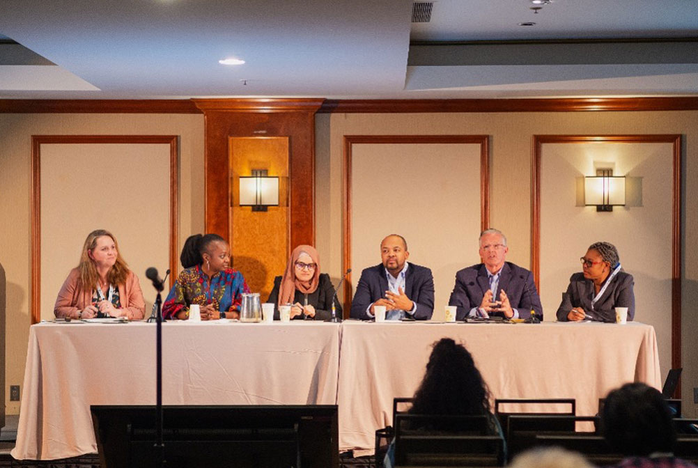 (From left to right) Dr. Anna Helova (first from left) and Dr. Bhekumusa Lukhele (fourth from left) presenting on the "Breaking down Barriers: Navigating Technology Access Disparities and Ethical Imperatives for Equitable and Sustainable Global Health Operations" panel along with other colleagues.