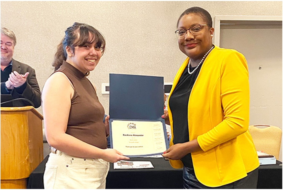 Student receiving CMA award