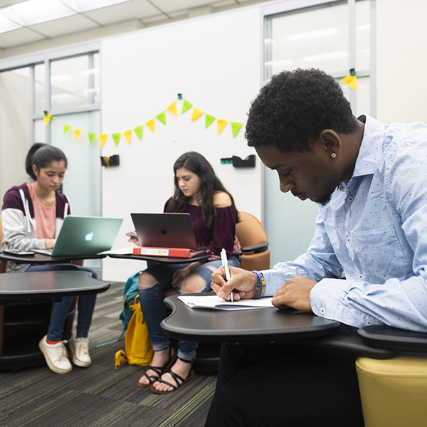 Students sitting in chairs and studying inside the Vulcan Materials Academic Success Center located insisde the Education Building, 2019.