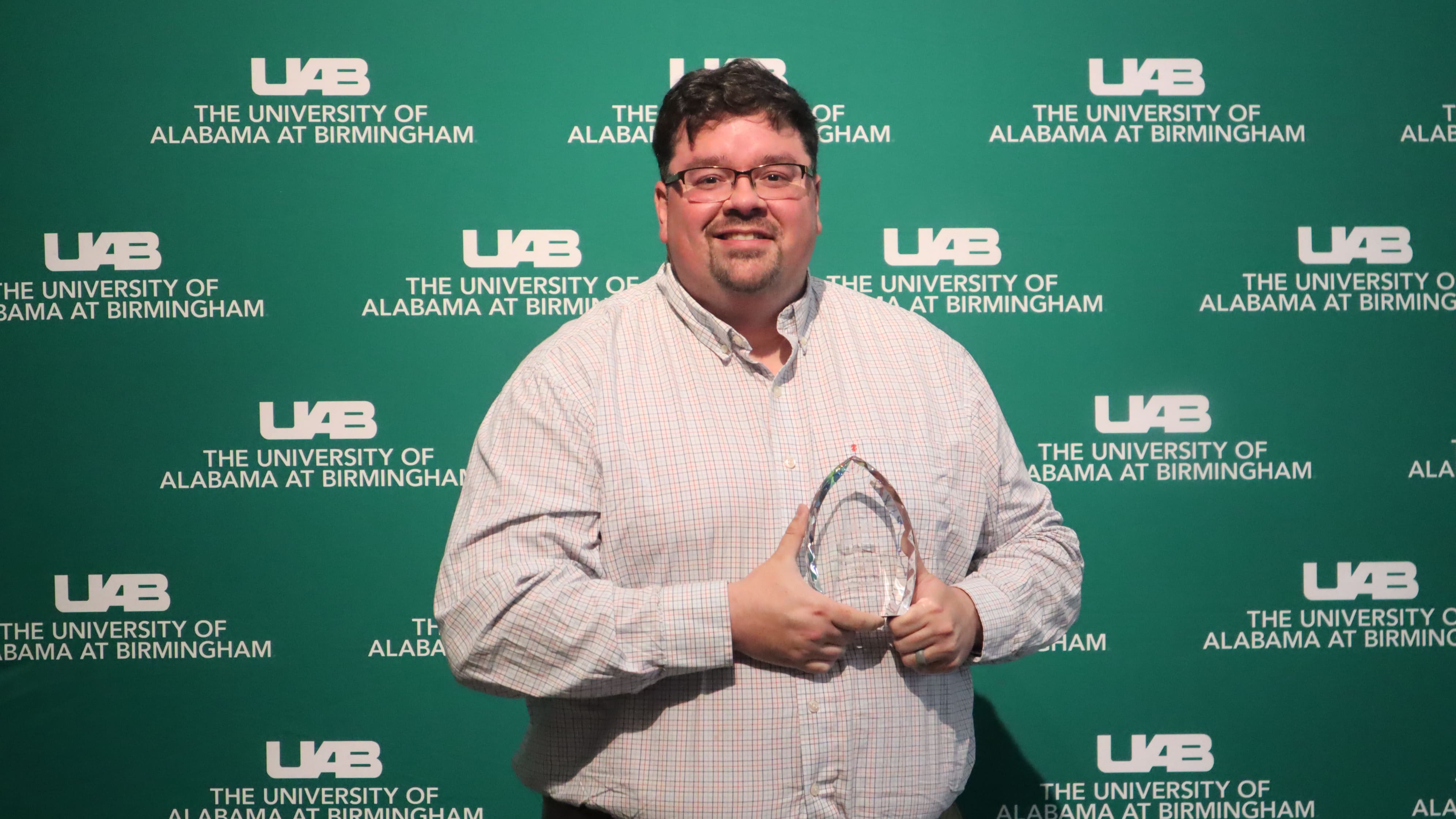 Michael Norris with the Outstanding Star (Professional) award at 2025 End of the Year Luncheon