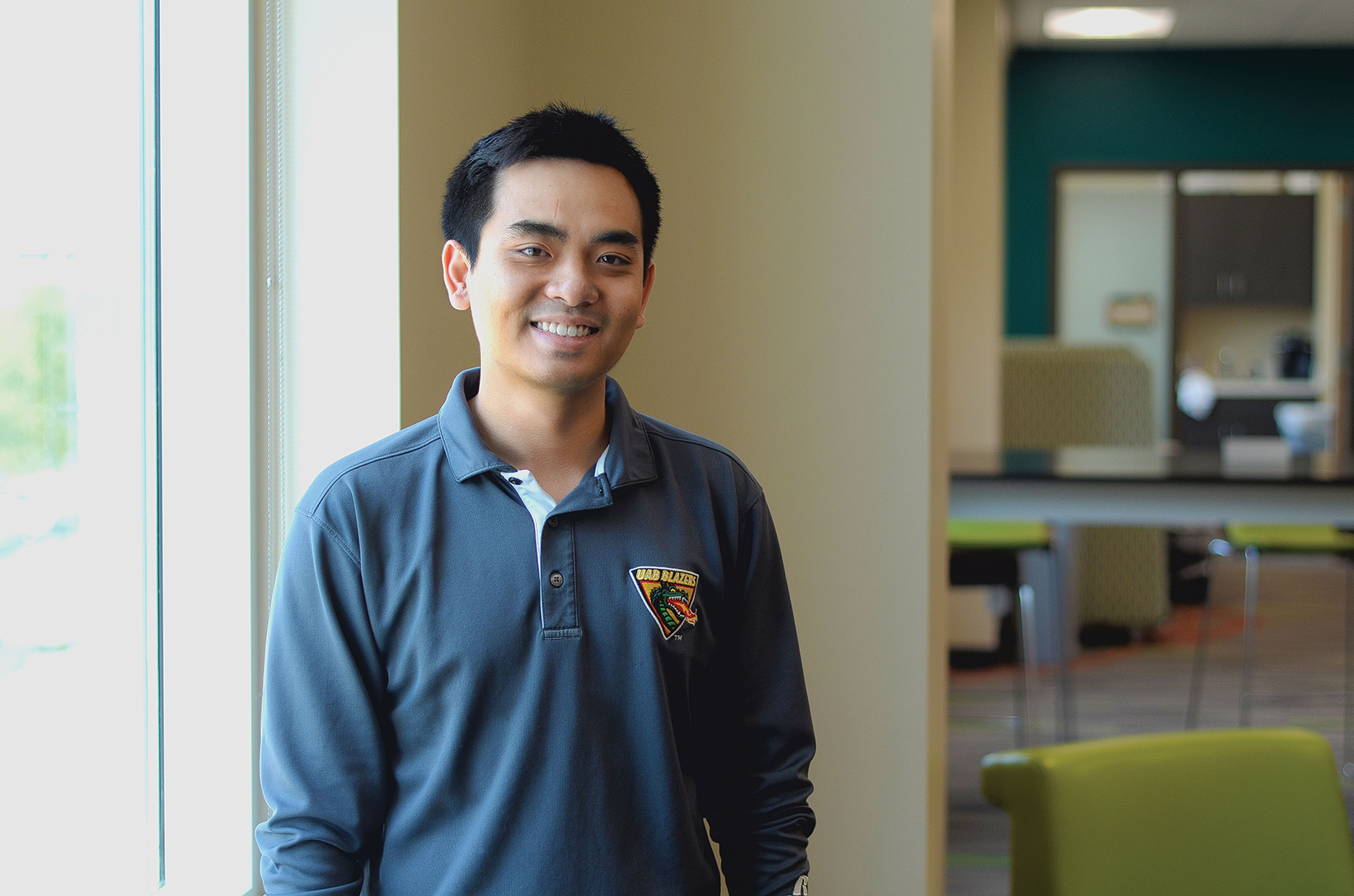 Quang Do currently works in the Hill Student Center as a coordinator of student leadership. Photo by Ian Keel