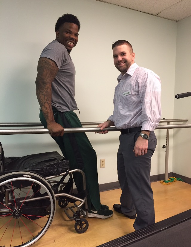 Tim Alexander stands again after 10 years of being paralyzed. Photo courtesy of Tim Alexander