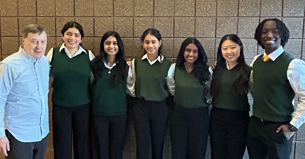 EMSAP students in green vests with Dr. Pence