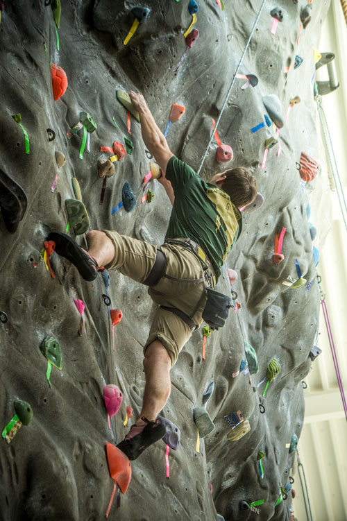 Photo of student on climbing wall