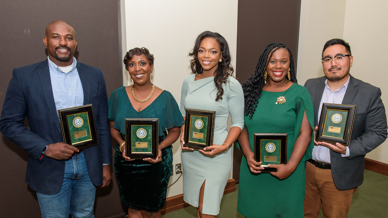 Graphic: Valentine Nwachukwu, Valencia Wells, O.D., Brittany Dionne, Davina Patterson and Jose O. Maximo, Ph.D. at the Alumni Awards Dinner ceremony. 