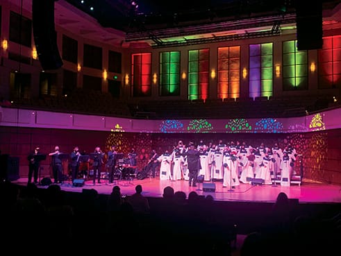 The UAB Gospel Choir performs on stage at the Jemison Concert Hall.