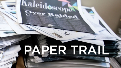 Photo of stacks of Kaleidoscope newspapers; headline: Paper Trail