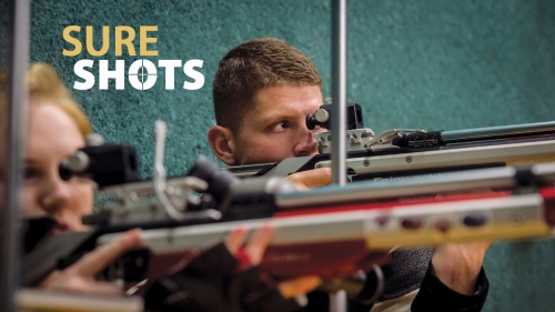 Photo of UAB rifle athlete taking aim at a target; headline: Sure Shots
