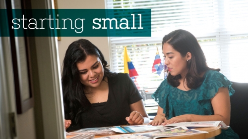 Photo of Dalila Gonzalez and Vanessa Vargas looking at Latino News newspapers; headline: Starting Small