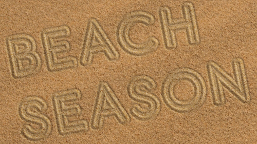Photo illustration of sand with headline traced into it; headline: Beach Season