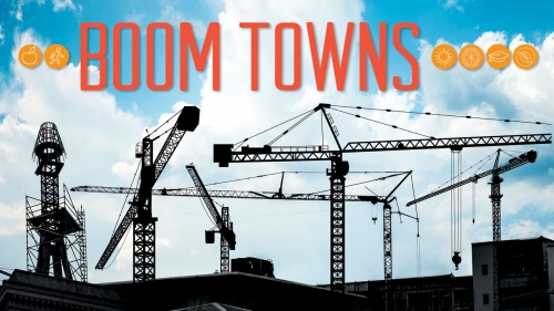 Illustration of cranes above city buildings; title: Boom Towns
